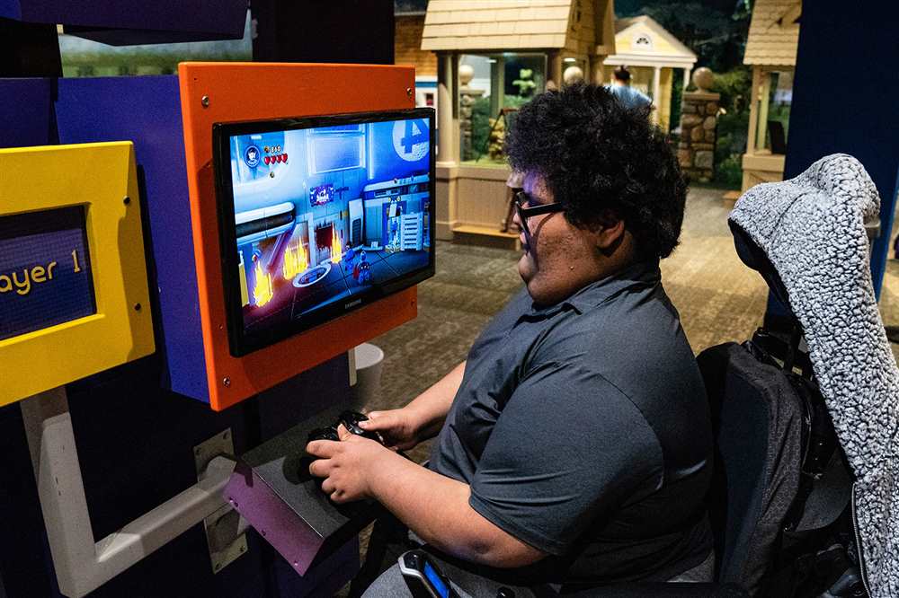 Child playing a game at Minecraft exhibit