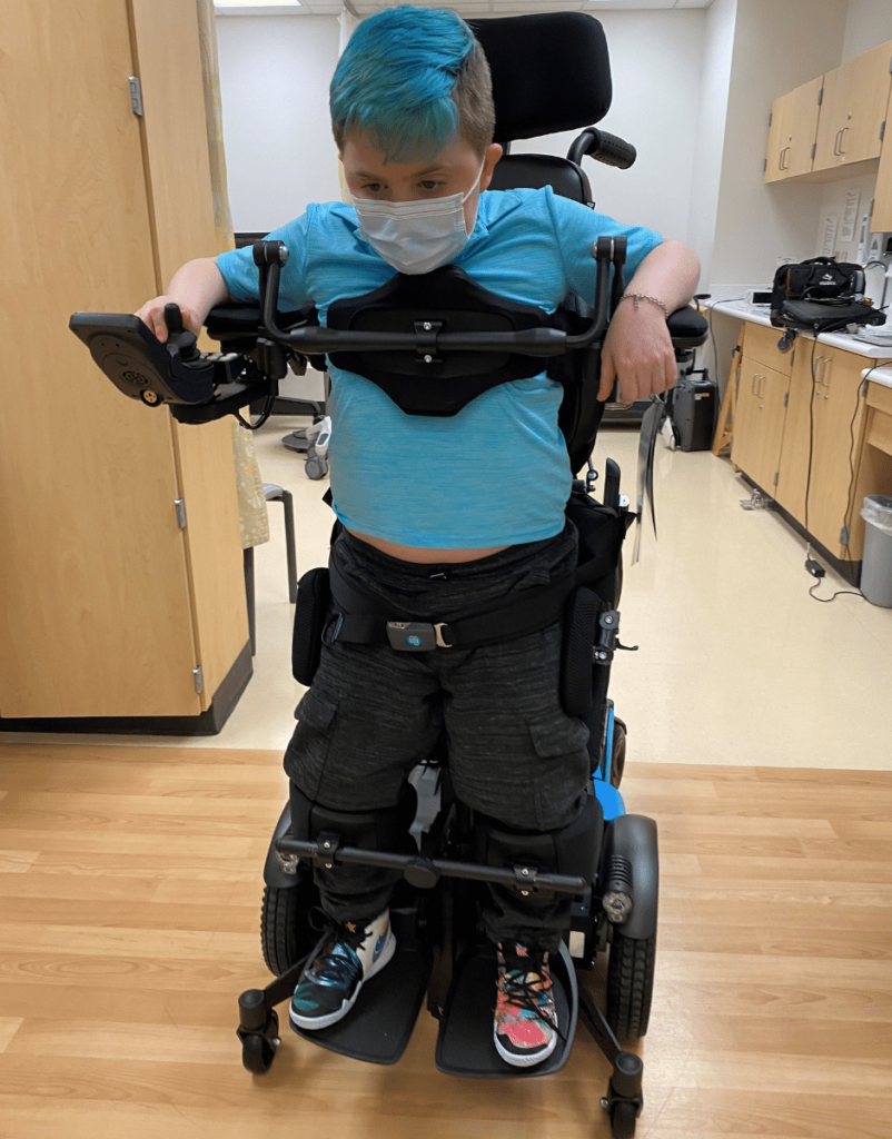 Gabe using stander