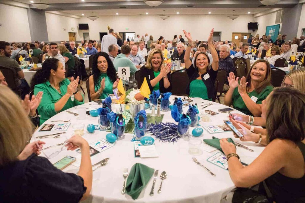 Royal table winners sitting at table